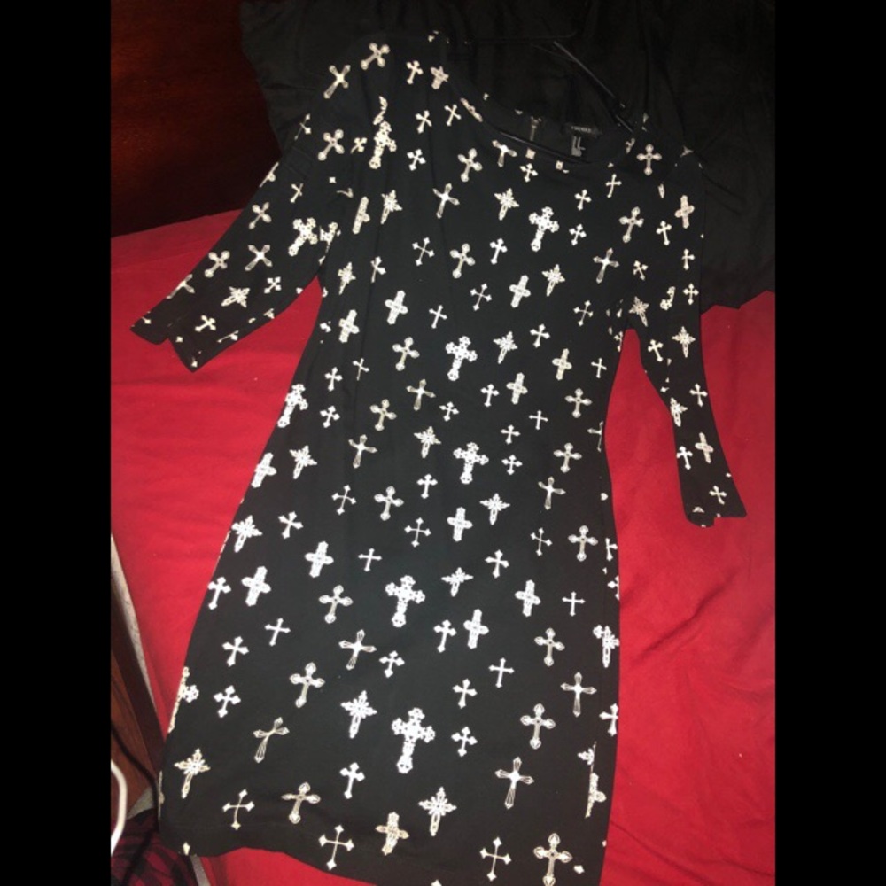 Black dress w/ crosses.